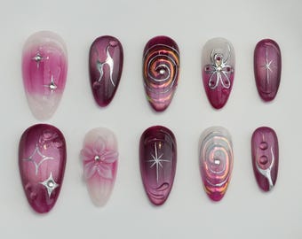 Unghie finte effetto occhi di gatto fatte a mano: nail art con stella cromata dorata 3D