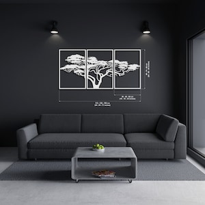 Op de afbeelding: Witte metalen wandkunst met een gestileerd boomsilhouet in drie panelen. De panelen zijn 40 x 61 cm en 113 x 28 cm.