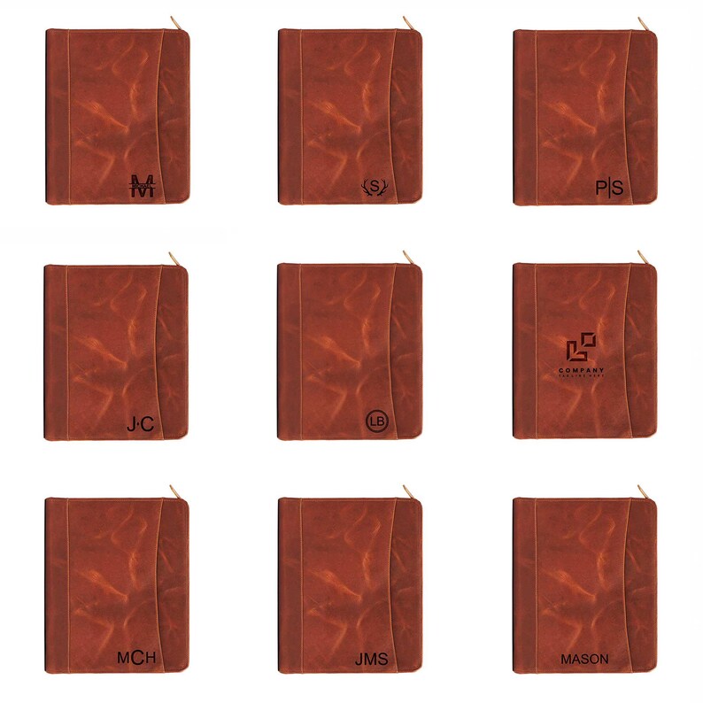 May include: Nine brown leather journals with gold zippers. Each journal has a unique design, including initials like "M", "S", "P/S", "J/C", "L/B", and "JMS", along with a company logo and the name "MASON".