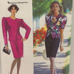 May include: Simplicity sewing pattern number 7100 for sizes UK 16-24, or EUR 44-52. The pattern includes two different looks: a pink suit with a jacket and skirt, and a floral print top with a black skirt. The pattern is for Damon Dress Inc.