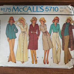 May include: Vintage McCall's 5710 sewing pattern featuring illustrations of women's shirt-dresses, jackets, and pants. The pattern includes a bust size of 36 inches and the price is $1.75. The cover art showcases various outfit styles.