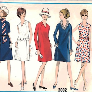 May include: A vintage sewing pattern for four different dress styles. The pattern is for Vogue's Basic Design 2002 and features a blue, red, and white color scheme.