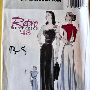 May include: Vintage Butterick sewing pattern B5136, featuring a Retro '48 design. The pattern includes illustrations of elegant evening gowns, including a black one-shoulder dress and a white gown with a red cape. Size AA (6-8-10-12).