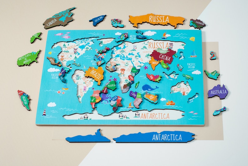 Wooden world map Montessori puzzle for kids features a colorful world map with the names of the countries, continents, and oceans.