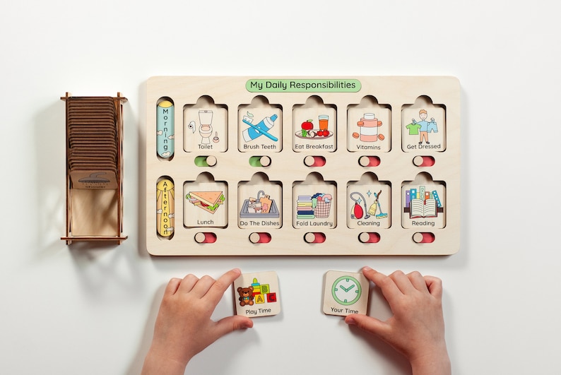 May include: A wooden board with a daily routine chart for kids. The chart has slots for cards with pictures of activities like brushing teeth, eating breakfast, and reading. The board also has a slot for a card that says "My Daily Responsibilities".