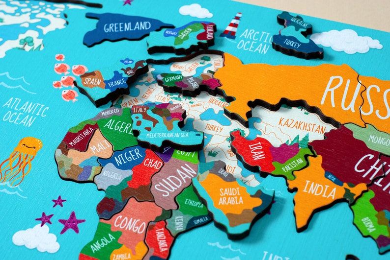 Wooden world map Montessori puzzle for kids features a colorful world map with the names of the countries, continents, and oceans.