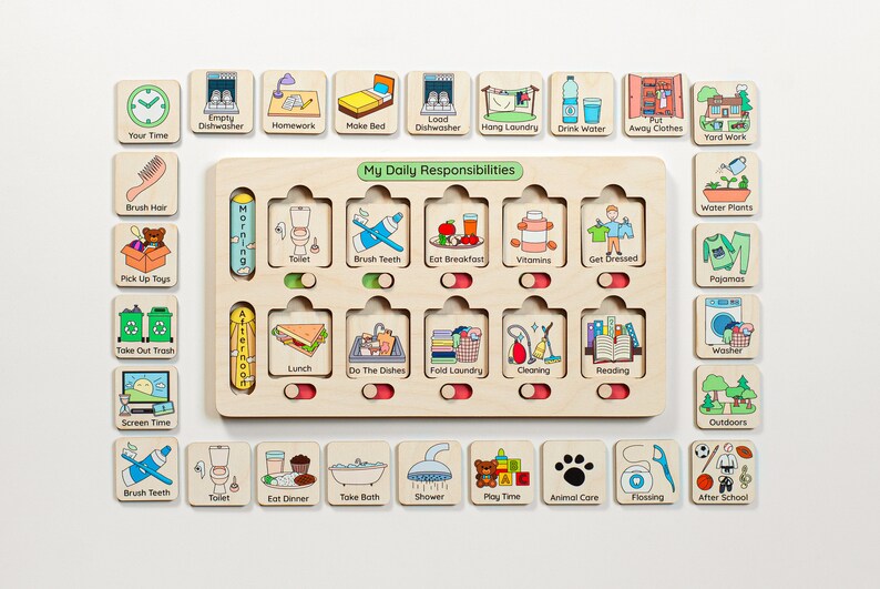 May include: A wooden board with a cutout for cards, labeled "My Daily Responsibilities".  The board has two columns, one for "Morning" and one for "Afternoon".  Each column has slots for cards with images and text representing daily tasks, such as "Brush Teeth", "Eat Breakfast", "Do the Dishes", and "Fold Laundry".  There are also separate cards with images and text for other tasks, such as "Water Plants", "Pajamas", and "Screen Time".