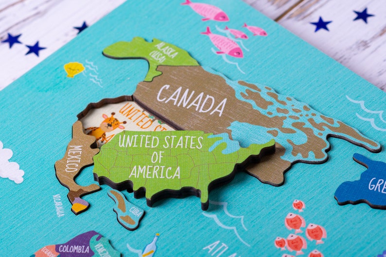 Wooden world map Montessori puzzle for kids features a colorful world map with the names of the countries, continents, and oceans.