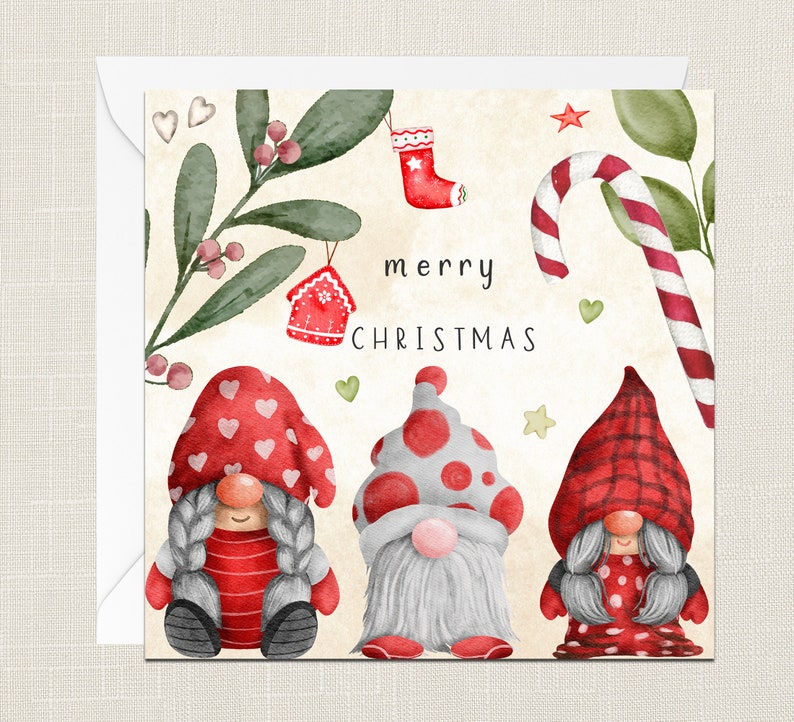 May include: A Christmas card featuring three gnomes wearing red and white hats with a festive green and red background. The card says "merry christmas" in black text.