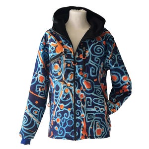 May include: A blue, orange and white patterned jacket with a black hood and zip closure.