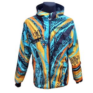 May include: A blue, yellow, orange, and black patterned jacket with a zipper closure and a hood. The jacket has a logo on the left chest that says "TRANCE".