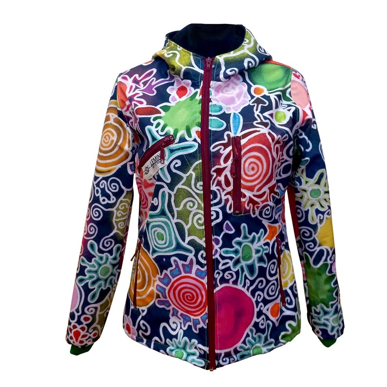 May include: A colourful hooded jacket with a zip closure and a variety of abstract designs in shades of blue, green, yellow, orange, pink, and red. The jacket has a pocket on the left side and a zip pull with the text "S-EMMA" on it.