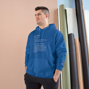 May include: A royal blue hooded sweatshirt with the word "go bills" defined as "a love, endearment, peace, a place commonly used as a greeting or farewell.  Has a deeper meaning, signifies a welcoming, warm invitation, defines a love of country with the environment and neighbors."