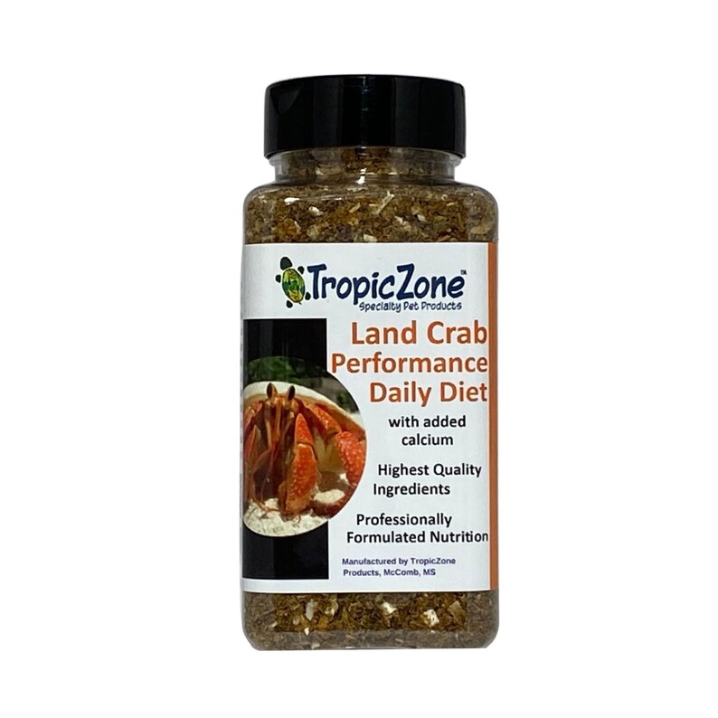 May include: A clear plastic jar filled with brown and beige land crab food. The label reads "Tropic Zone Specialty Pet Products Land Crab Performance Daily Diet with added calcium Highest Quality Ingredients Professionally Formulated Nutrition Manufactured by TropicZone Products, McComb, MS".