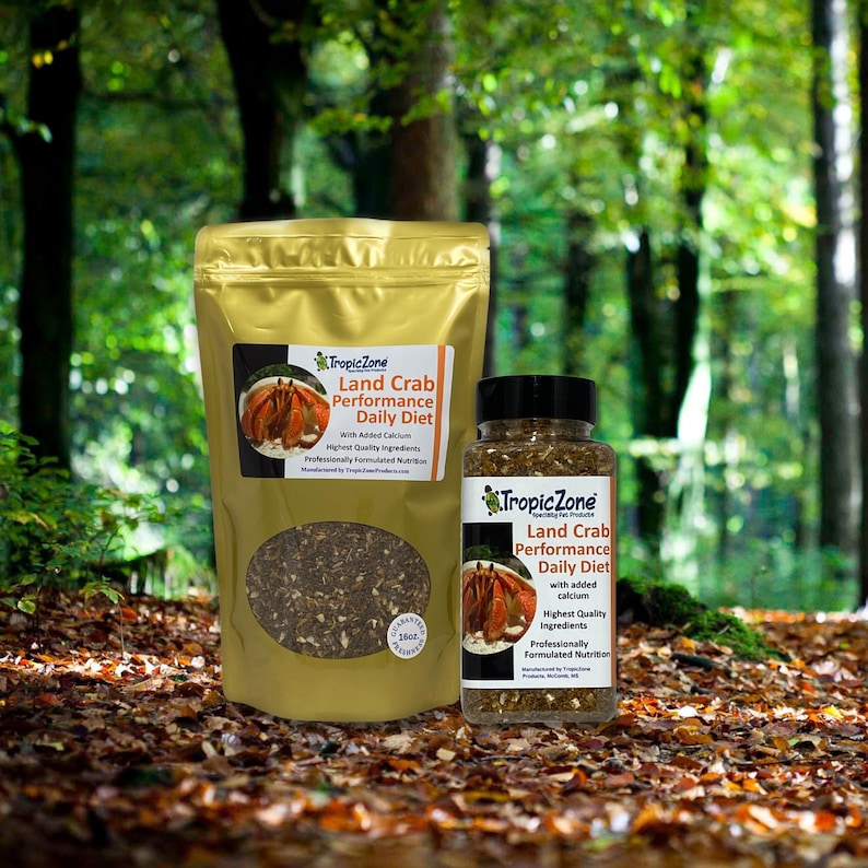May include: Two containers of land crab food, one a 16 oz bag and the other a smaller jar. Both containers are gold with black text and feature a cartoon crab on the label. The text on the label reads "Tropic Zone Land Crab Performance Daily Diet with Added Calcium".