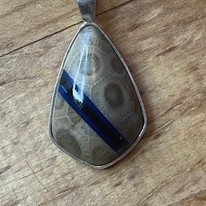 Michigan Petoskey stone pendant with recycled vinyl middle stripe, on 18” sterling silver plated chain