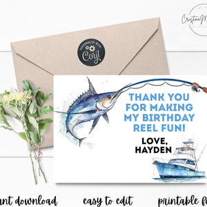 May include: A blue and white thank you card with a watercolor illustration of a marlin being caught on a fishing line. The card says "Thank you for making my birthday reel fun! Love, Hayden".