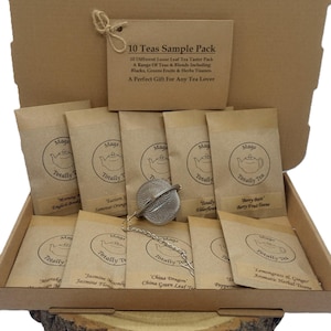 May include: A cardboard box containing ten brown paper pouches of loose leaf tea, each labelled with a Mags Totally Tea logo and a specific tea name. A metal mesh tea infuser ball with a chain rests on the pouches. A card reads 10 Teas Sample Pack.