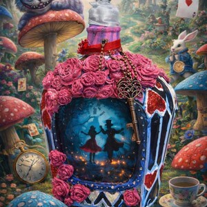 May include: A whimsical, decorative bottle with a pink crystal stopper, adorned with pink roses and a key pendant. The bottle features an Alice in Wonderland scene with dancing figures. The background includes mushrooms, a Cheshire Cat, and a white rabbit.