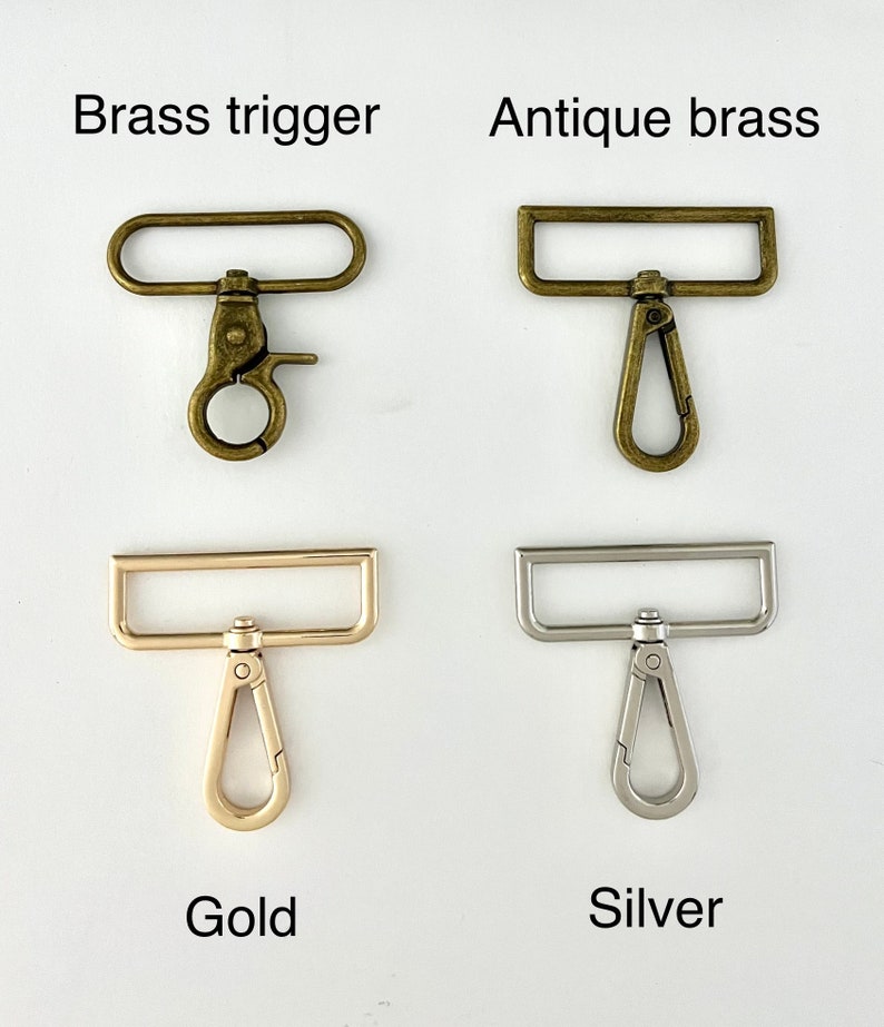 May include: Four different types of metal trigger clasps.  The clasps are in brass trigger, antique brass, gold, and silver finishes.  Each clasp has a rectangular loop and a trigger hook.