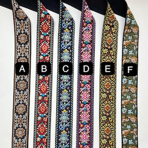 May include: Six different patterned fabric trims, labeled A through F, with a variety of colors and designs. The trims are all approximately 1 inch wide.
