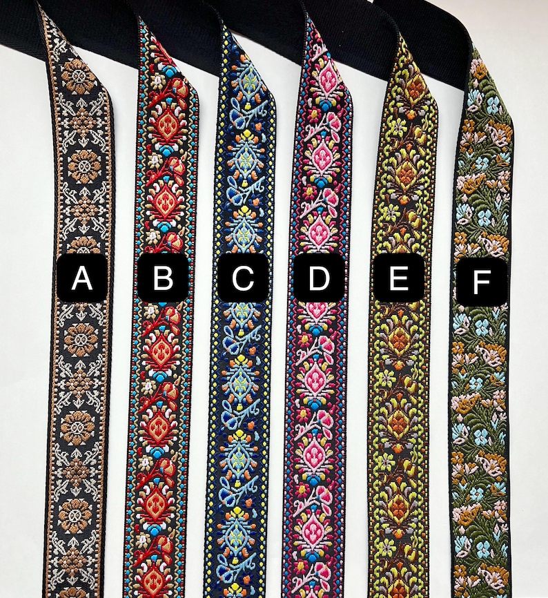 May include: Six different patterned fabric trims, labeled A through F, with a variety of colors and designs. The trims are all approximately 1 inch wide.