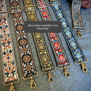 May include: Six adjustable bag straps featuring various woven patterns in colours including cream, black, red, blue, and gold. Each strap includes antique brass-toned metal hardware, sliders, and swivel lobster clasps. Text reads: More styles available in my Etsy shop!