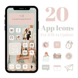 K&ouml;nnte beinhalten: Ein Smartphone zeigt einen benutzerdefinierten Startbildschirm mit App-Symbolen und Widgets. Der Bildschirm hat ein hellrosa und beiges Farbschema mit dem Text "I am manifesting my dream life". Das Bild enth&auml;lt auch 20 App-Symbole f&uuml;r das iOS 14-Update.