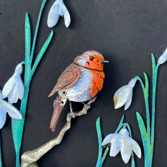 A hand-carved, oil-painted mechanical robin that actually moves — this is the kind of heirloom automaton you'd find in a Victorian curiosity cabinet.