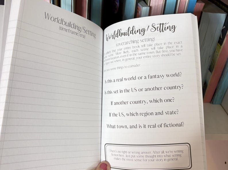 May include: A notebook page with the title "Worldbuilding/Setting" and a list of questions to help writers develop their story's setting. The questions include: "Is this a real world or a fantasy world?", "Is this set in the US or another country?", and "What town, and is it real or fictional?"