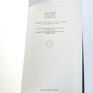 May include: A book with a white cover and black text. The text reads "This book designed by William B. Taylor is a production of Heron Books, London." The text also includes copyright information for the book.