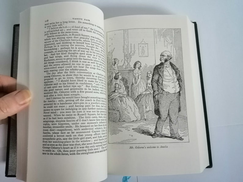May include: A black and white illustration of a man standing in a room with a group of women. The man is wearing a suit and has a beard. The women are wearing dresses. The caption below the image reads "Mr. Osborne's welcome to Amelia."