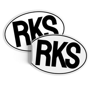 May include: Two white oval stickers with black text that reads "RKS".