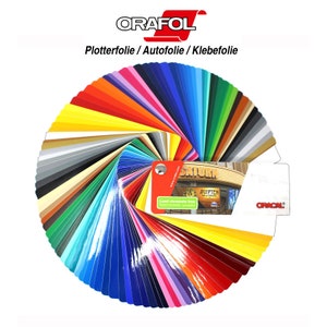 Puede incluir: Una carta de colores en forma de abanico con una variedad de colores de vinilo. La carta est&aacute; etiquetada como "Oracal" y "Plotterfolie / Autofolie / Klebefolie".