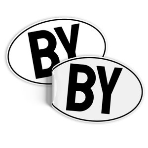May include: Two white oval stickers with black lettering. Each sticker says "BY" in large, bold letters.
