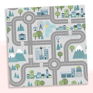 May include: A gray and blue playmat with a city scene. The playmat features roads, buildings, trees, a Ferris wheel, a construction crane, and a parking lot. The text "SCHOOL" and "POLICE" are visible on the playmat.