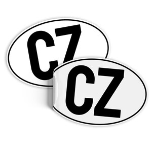 May include: Two white oval stickers with black lettering. One sticker says "CZ" and the other says "C7".