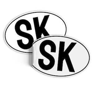 May include: Two white oval stickers with black lettering. Each sticker says "SK" in bold, black letters.