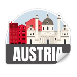 Może przedstawiać: Naklejka z kolorową ilustracją budynków w Austrii. Naklejka ma szary tło z napisem "AUSTRIA" w białym kolorze.