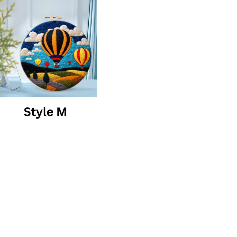 May include: A round embroidery hoop featuring a colourful needlepoint design of hot air balloons against a blue sky with white clouds. The balloons are yellow, red and black with white stripes. The background is a green and brown landscape.