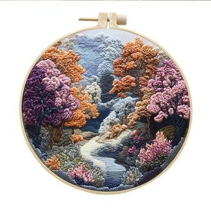 May include: A circular embroidery hoop with a colorful landscape scene. The scene features a winding path through a forest with trees in shades of purple, pink, orange, and blue.