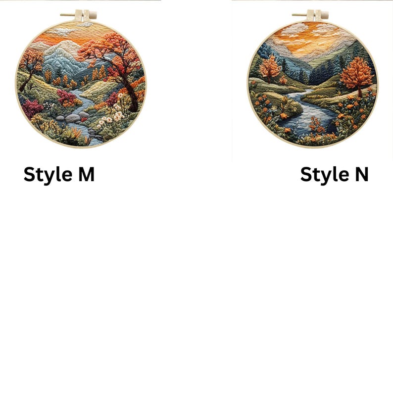 May include: Two embroidery hoop art pieces with autumnal landscapes. The left hoop features a mountain scene with a winding river and a red, orange, and yellow tree. The right hoop features a similar scene with a river and a tree with orange and yellow leaves.