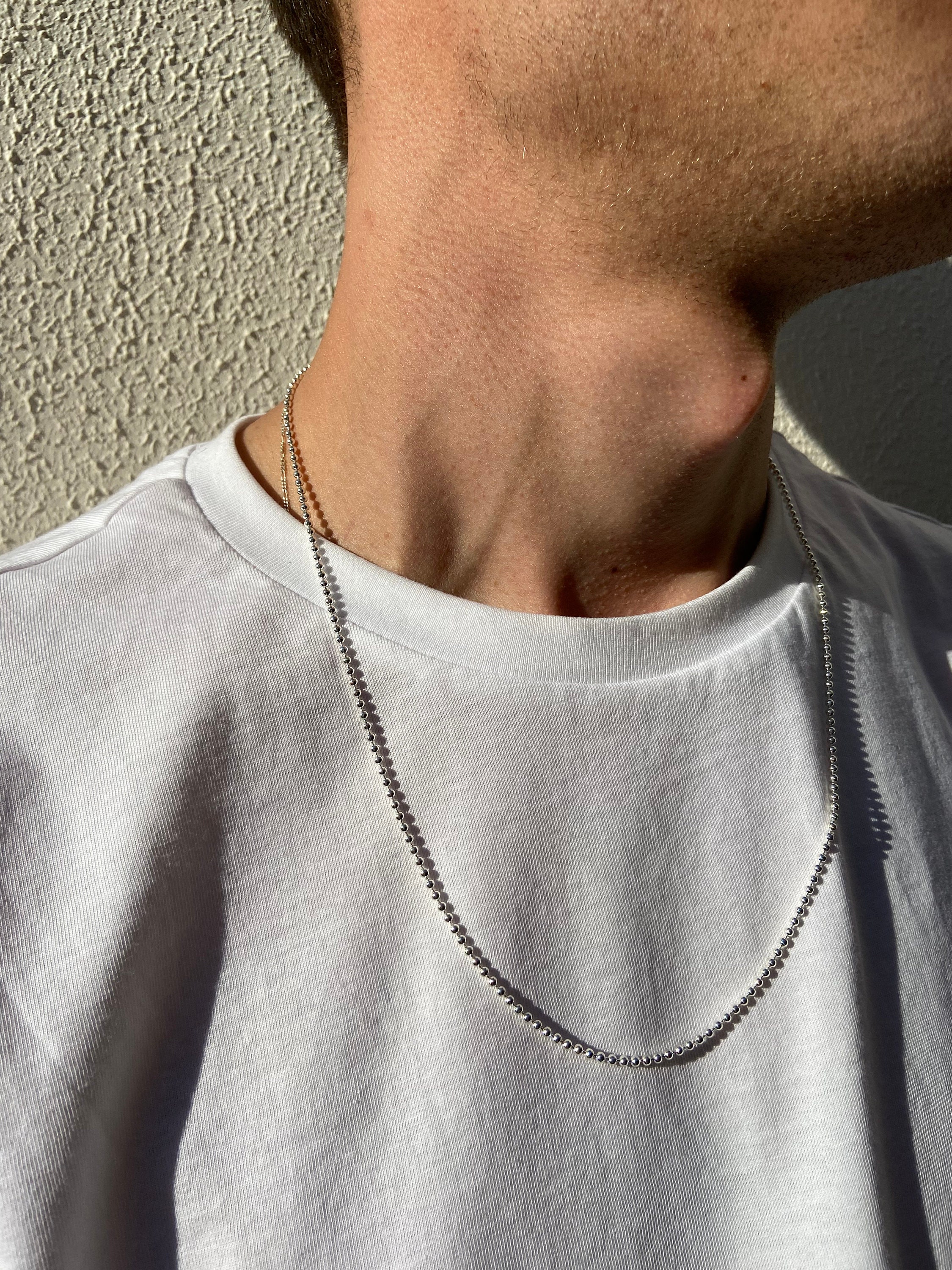 Guys wearing silver chains discount