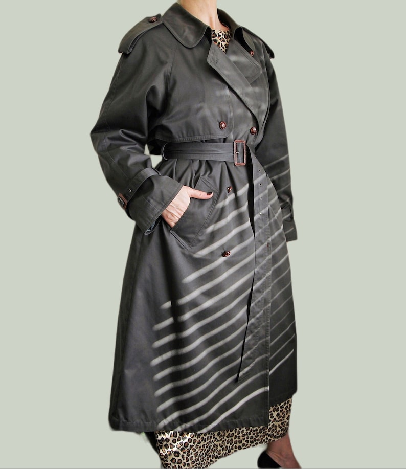 Model wearing vintage 1999s Dark grey belted trench coat