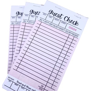 May include: Three pink and white guest check pads. Each pad has a header that reads "Guest Check" in a script font. The checks have lines for itemizing orders and include the text "Thank you! Please visit again."
