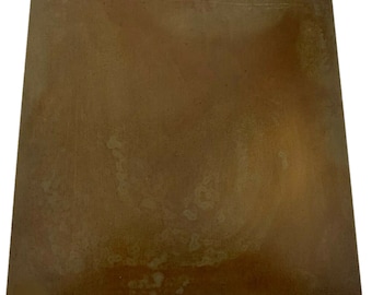 May include: A square, rusty brown metal pizza stone.