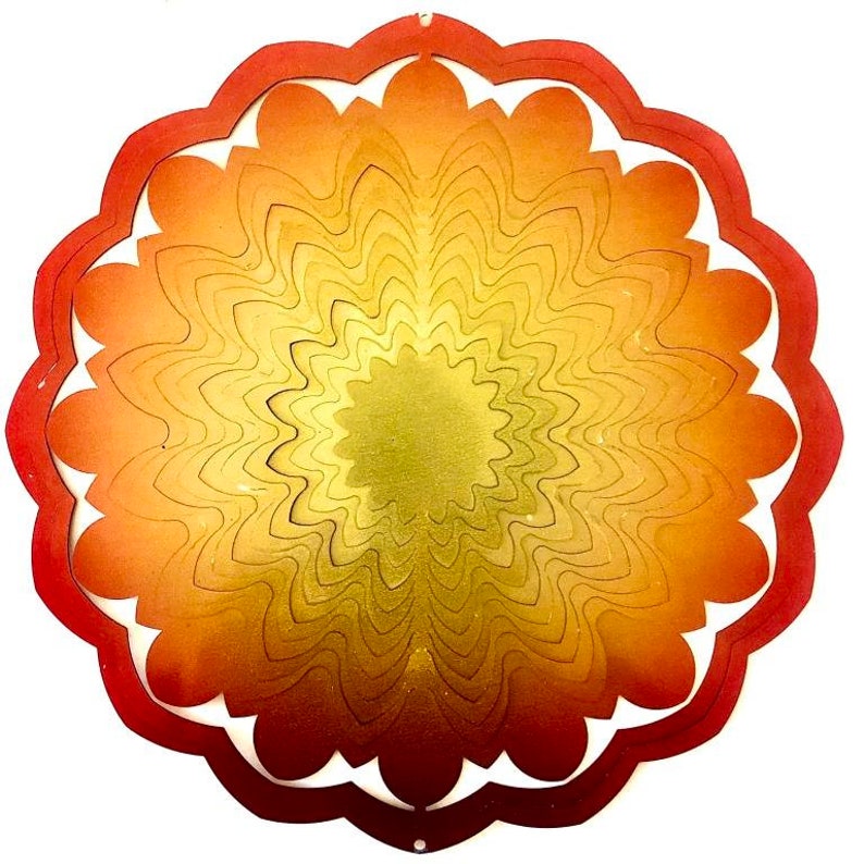 May include: A red, orange, and yellow metal wind spinner with a circular design. The spinner has a layered, concentric pattern that creates a swirling effect.