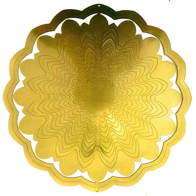 May include: A gold metal wind spinner with a flower design. The spinner has multiple layers of petals that create a swirling effect when it spins in the wind.