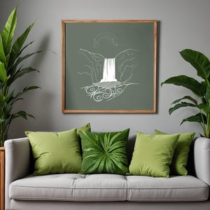 May include: A framed artwork with a white line drawing of a waterfall on a muted green background. The artwork is above a grey sofa with green cushions and leafy plants. The frame is made of wood.