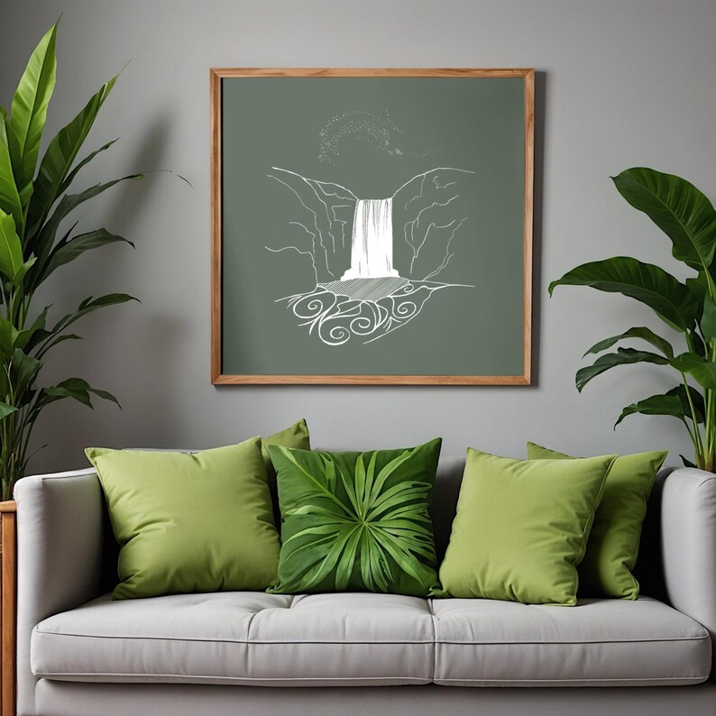 May include: A framed artwork with a white line drawing of a waterfall on a muted green background. The artwork is above a grey sofa with green cushions and leafy plants. The frame is made of wood.